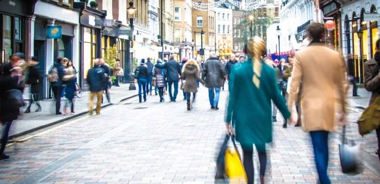 people walking down a high street